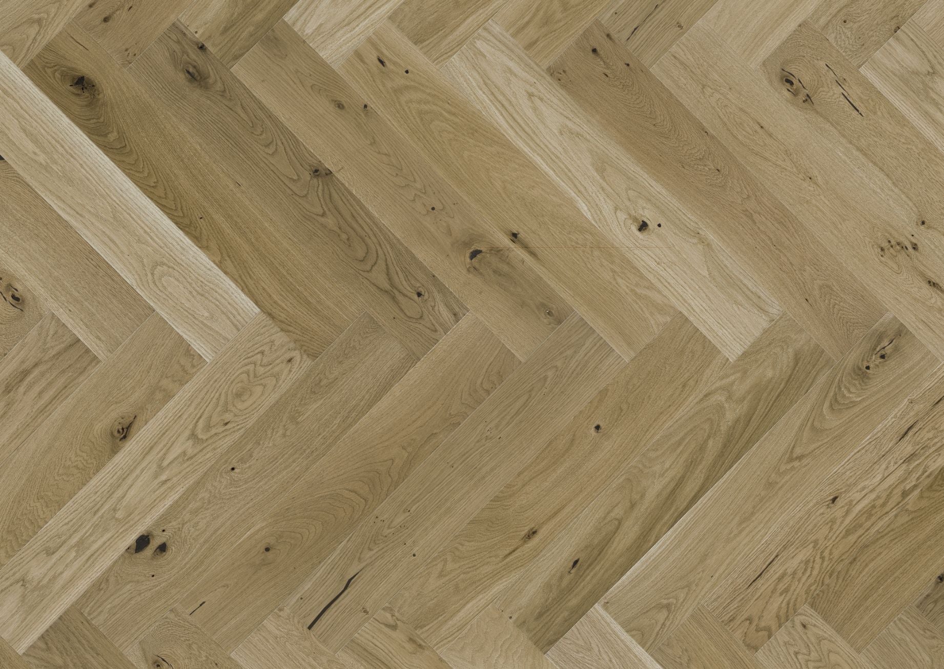 Natural wood flooring laid in herringbone pattern